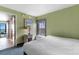 Bright bedroom with comfortable bedding, side table, and beach-themed art at 3000 N Ocean Blvd. # 333, Myrtle Beach, SC 29577