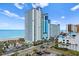 Gorgeous exterior shot of the high rise building and road with palm trees, close to the beautiful beach at 3000 N Ocean Blvd. # 333, Myrtle Beach, SC 29577
