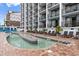 Relaxing outdoor lazy river with poolside lounge chairs at 3000 N Ocean Blvd. # 333, Myrtle Beach, SC 29577