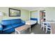 Inviting living area with a pull-out bed, blue sofa, and dining table at 3000 N Ocean Blvd. # 333, Myrtle Beach, SC 29577