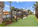 Poolside view with outdoor seating in gazebo structures with nice lawn area and landscaping and a view of the water slide at 3000 N Ocean Blvd. # 333, Myrtle Beach, SC 29577