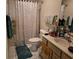 Full bathroom featuring a shower, toilet, and vanity area at 330 S Middleton Dr. # 603, Calabash, NC 28467