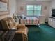 Cozy bedroom with comfortable seating and plenty of natural light at 330 S Middleton Dr. # 603, Calabash, NC 28467
