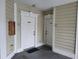 Building entrance featuring two white painted doors, door numbers, and no smoking signs at 330 S Middleton Dr. # 603, Calabash, NC 28467