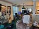 Living room with green carpet, recliner, ceiling fan, and framed artwork on the wall at 330 S Middleton Dr. # 603, Calabash, NC 28467