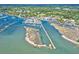 Aerial view showcasing waterfront community and long fishing pier in a scenic coastal setting at 35 Delray Dr. # 3A, Murrells Inlet, SC 29576