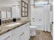 Well-lit bathroom with granite countertop, white cabinetry, and a shower-tub combination at 35 Delray Dr. # 3A, Murrells Inlet, SC 29576
