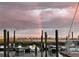 Scenic waterfront view of boats docked with waterfront homes and a rainbow in the background at 35 Delray Dr. # 3A, Murrells Inlet, SC 29576