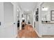 Inviting hallway with hardwood floors leads to bedrooms and bathroom with granite vanity top at 35 Delray Dr. # 3A, Murrells Inlet, SC 29576