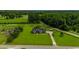 Expansive aerial view of a house with a long driveway surrounded by lush greenery at 3511 Sumpter Rd., Loris, SC 29569