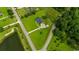 Overhead view showcasing a house with a large yard near a serene pond and woods at 3511 Sumpter Rd., Loris, SC 29569