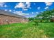 Spacious brick home exterior showcases a well-manicured lawn and access to the backyard at 3511 Sumpter Rd., Loris, SC 29569
