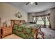 Bedroom featuring a bed with colorful bedding, natural light from the windows, and wood furniture at 3511 Sumpter Rd., Loris, SC 29569