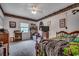 Bedroom with a bed, natural light from the windows, and wood furniture at 3511 Sumpter Rd., Loris, SC 29569