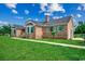 Charming brick home boasts lush green lawn, gabled roof, and coordinated green shutters at 3511 Sumpter Rd., Loris, SC 29569