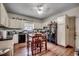 Traditional style kitchen featuring wooden table with white cabinets and black appliances at 3511 Sumpter Rd., Loris, SC 29569