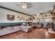 Large living room featuring hardwood floors, comfortable couches, and decorative elements at 3511 Sumpter Rd., Loris, SC 29569