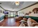 Spacious living room with hardwood floors, large windows, and comfortable seating at 3511 Sumpter Rd., Loris, SC 29569