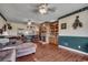 Spacious living room with hardwood floors, fireplace, built-in shelving, and lots of natural light at 3511 Sumpter Rd., Loris, SC 29569