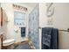 Well-lit bathroom with coastal decor, including a shower curtain with ocean-themed design at 356 Lakeside Crossing Dr., Conway, SC 29526