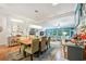 Open concept dining room flowing into the living room, featuring modern light fixture and coastal decor at 356 Lakeside Crossing Dr., Conway, SC 29526