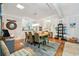 Bright dining room with a wooden table, seating for six, coastal decor, and lots of natural light at 356 Lakeside Crossing Dr., Conway, SC 29526