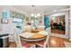 A lovely dining area showcasing natural lighting, wooden flooring, and an open layout at 356 Lakeside Crossing Dr., Conway, SC 29526