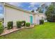 Home featuring a manicured lawn, neat landscaping, and a turquoise door that adds a pop of color at 356 Lakeside Crossing Dr., Conway, SC 29526