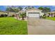 Charming one-story home with a well-manicured lawn and a driveway leading to an attached garage at 356 Lakeside Crossing Dr., Conway, SC 29526