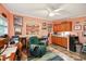 Functional home office with built-in shelving, desk, and a cozy chair at 356 Lakeside Crossing Dr., Conway, SC 29526