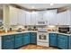 A bright kitchen featuring two-tone cabinets, modern appliances, and ample counter space at 356 Lakeside Crossing Dr., Conway, SC 29526