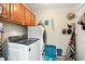 Well-lit laundry room equipped with modern appliances, convenient storage, and decor at 356 Lakeside Crossing Dr., Conway, SC 29526