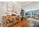 Bright living area with hardwood floors and decorative cabinet at 356 Lakeside Crossing Dr., Conway, SC 29526