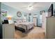 Comfortable main bedroom featuring light blue walls, a ceiling fan, and white furniture at 356 Lakeside Crossing Dr., Conway, SC 29526