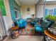 Cozy screened porch offering comfortable seating, decorative rug, and serene outdoor relaxation at 356 Lakeside Crossing Dr., Conway, SC 29526