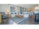 Bright and airy living room with hardwood floors, white sofas, and coastal-themed decor at 3575 Ashridge Way, Conway, SC 29526