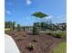 Community playground surrounded by lush landscaping and a secure fence at 3575 Ashridge Way, Conway, SC 29526