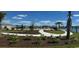 Community pool area with sun loungers near well-manicured landscaping at 3575 Ashridge Way, Conway, SC 29526