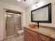 Bathroom featuring glass shower doors, wood cabinet with granite countertop and vessel sink at 3904 Williamson Circle, Myrtle Beach, SC 29579