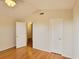 Bedroom featuring vaulted ceilings, two doorways, and wood flooring at 3904 Williamson Circle, Myrtle Beach, SC 29579