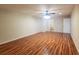 Spacious bedroom featuring hardwood floors, a ceiling fan, and access to an ensuite bathroom at 3904 Williamson Circle, Myrtle Beach, SC 29579