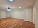 Spacious bedroom with hardwood floors, dual closets, and ample natural light from the skylight at 3904 Williamson Circle, Myrtle Beach, SC 29579