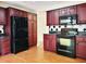 Modern kitchen with stainless steel appliances, dark wood cabinets, and stylish backsplash at 3904 Williamson Circle, Myrtle Beach, SC 29579