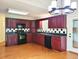Kitchen with wood cabinets, black appliances, granite countertops, and a black-and-white tile backsplash at 3904 Williamson Circle, Myrtle Beach, SC 29579