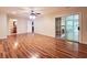 This open-concept living space has wood flooring, a ceiling fan, and sliding glass doors leading to an outdoor area at 3904 Williamson Circle, Myrtle Beach, SC 29579