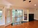 Elegant living room with beautiful glass french doors leading to a bright sunroom with fireplace at 3904 Williamson Circle, Myrtle Beach, SC 29579