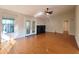 Inviting living room with hardwood floors, fireplace, and doors leading to the exterior of the home at 3904 Williamson Circle, Myrtle Beach, SC 29579