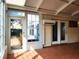 Bright sunroom featuring tile flooring, large windows, and access to the outdoors at 3904 Williamson Circle, Myrtle Beach, SC 29579