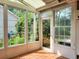 Enclosed sunroom featuring tile flooring and glass windows offering natural light at 3904 Williamson Circle, Myrtle Beach, SC 29579