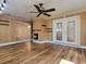 Sunroom featuring a ceiling fan, wood paneling and a sliding door at 3904 Williamson Circle, Myrtle Beach, SC 29579
